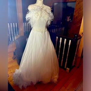 White custom dress sequined bodice feathered chest and train. Size 00